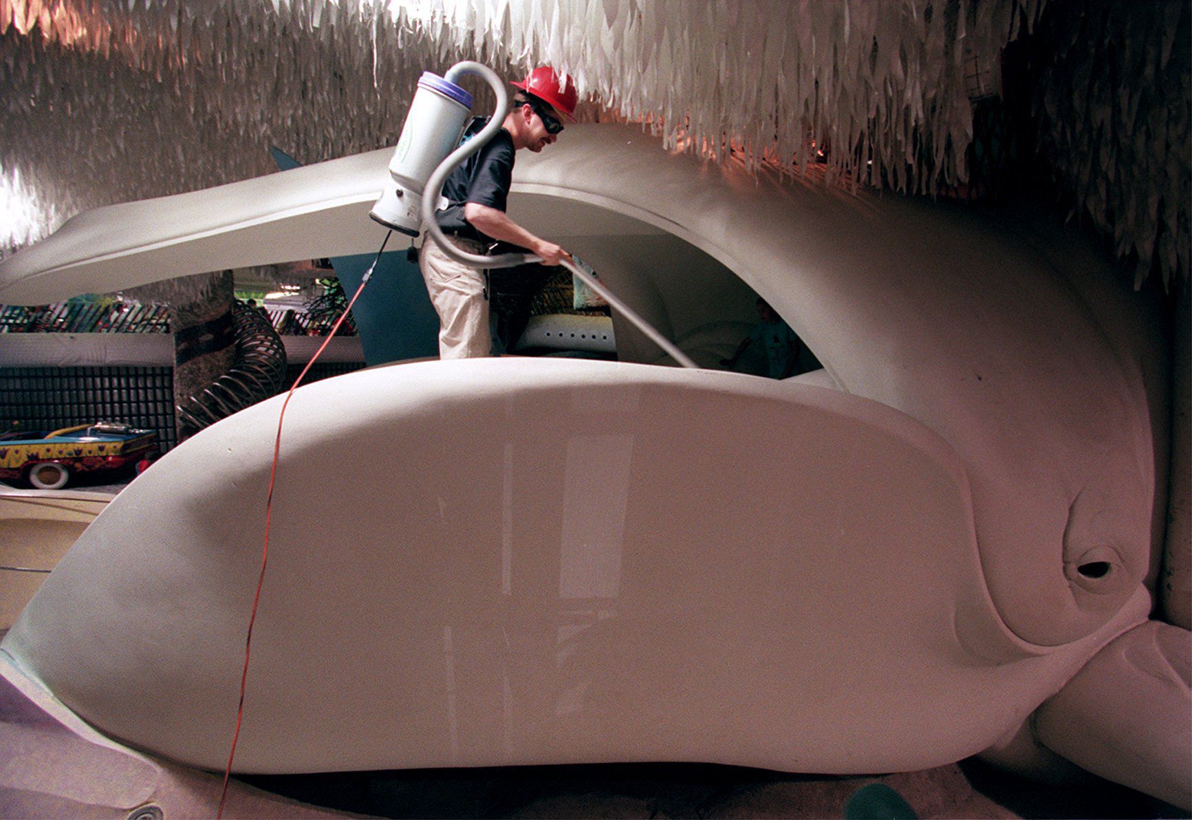 Vacuuming a lifesized whale replica at City Museum